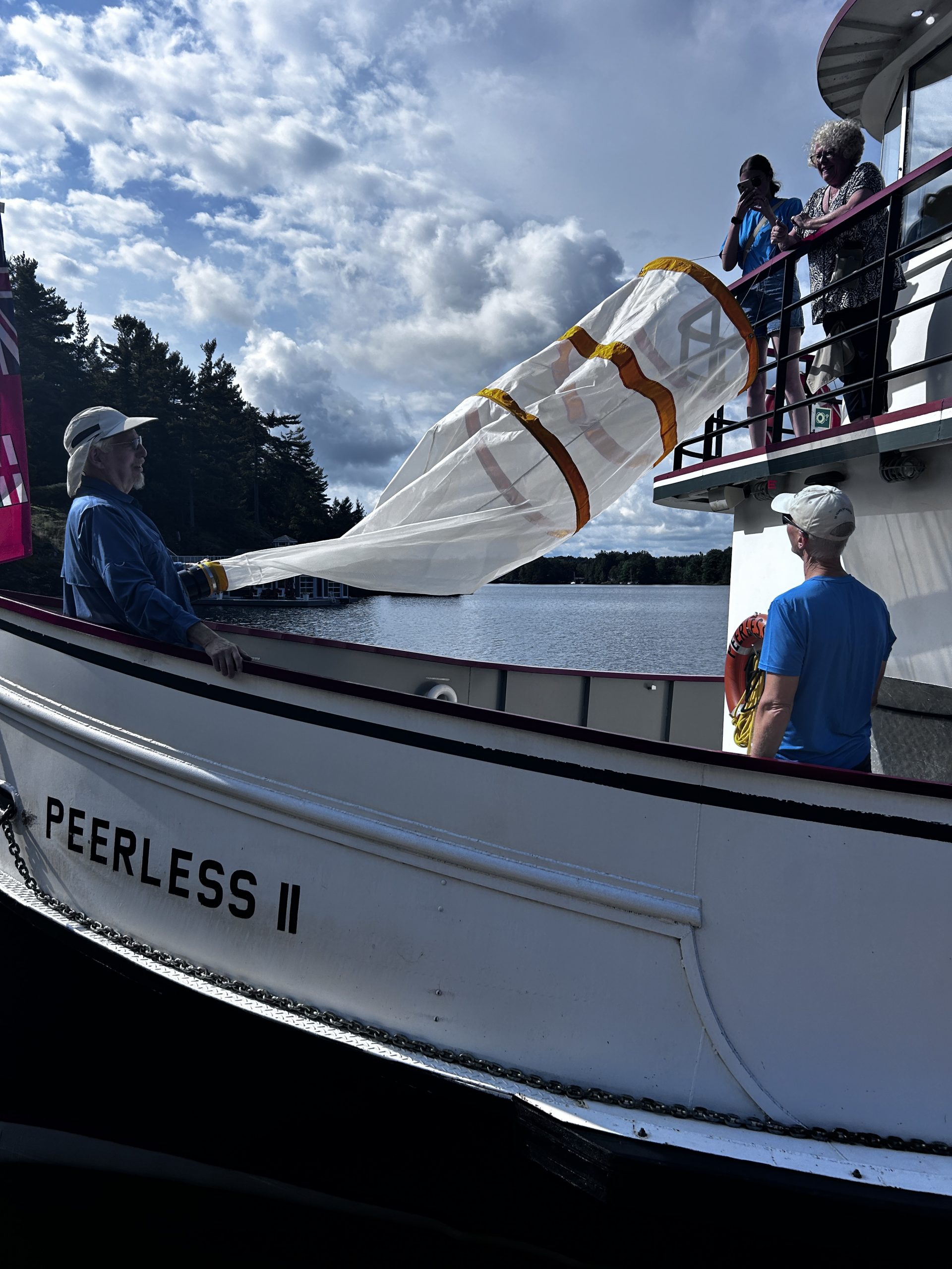 Dr. Norman Yan and Ron Ingram get ready to lower the net into the water on the 2025 Peer Under the Surface Cruise with Friends of the Muskoka Watershed.
